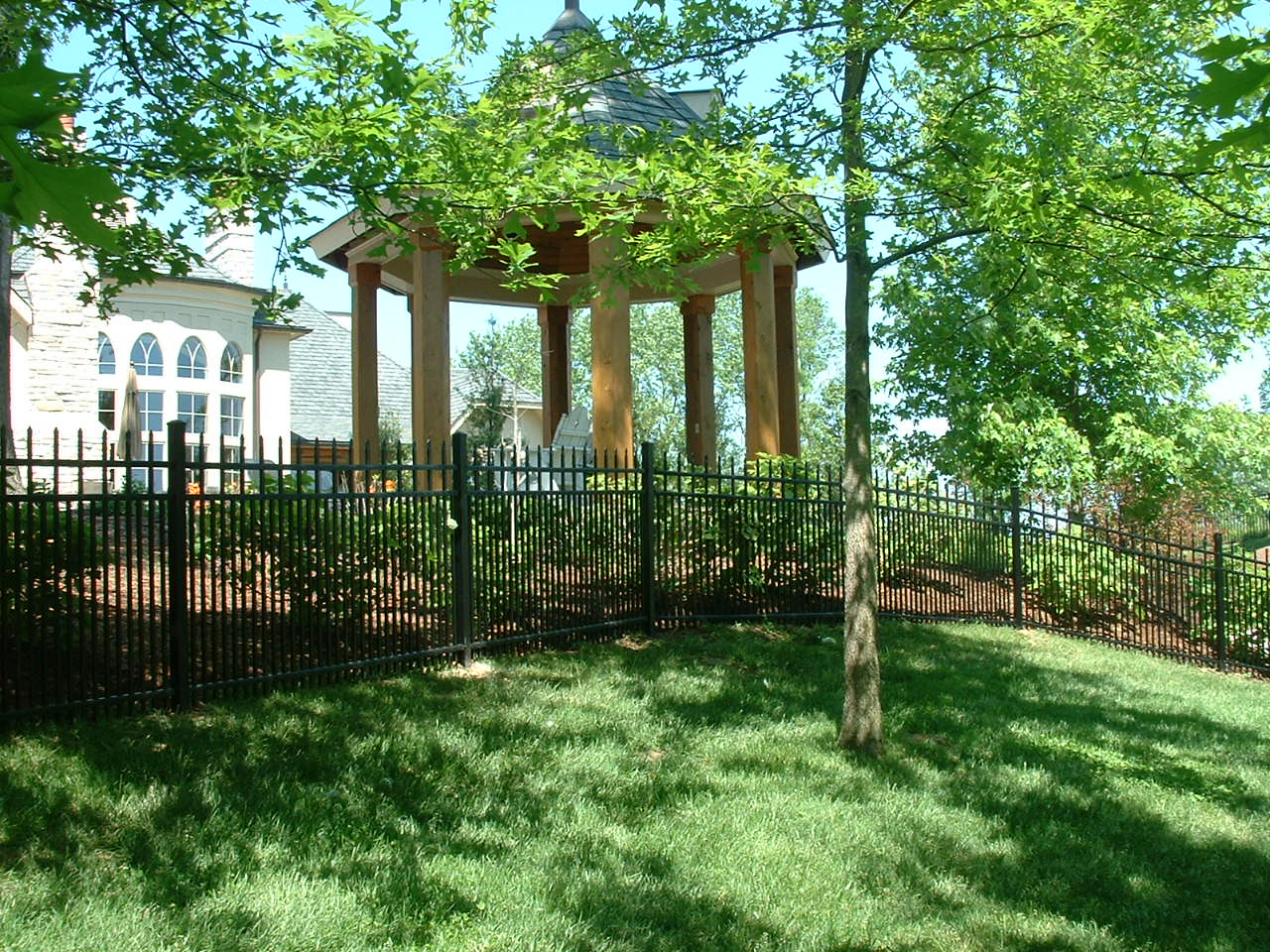 aluminum fence with gazebo in background