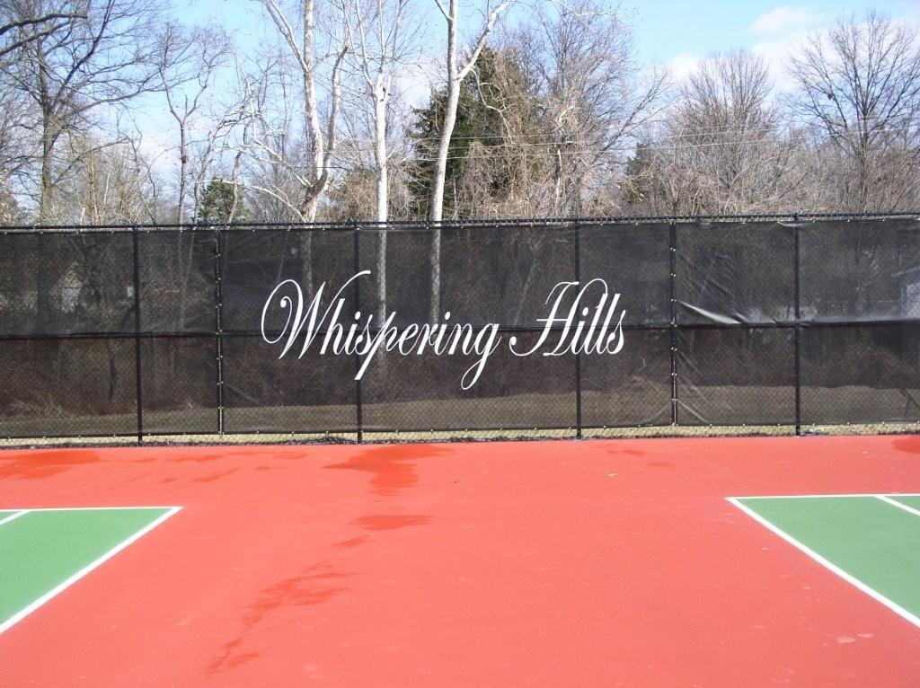 chain link fence surrounding a tennis court