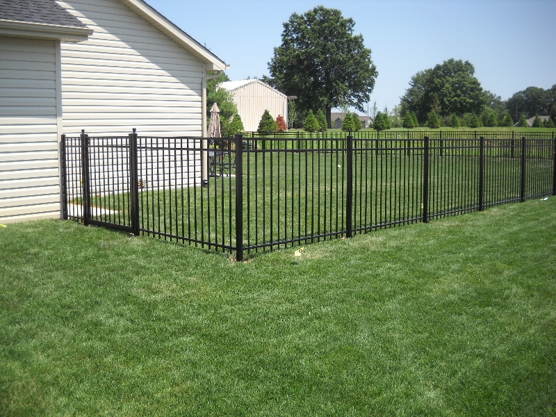 an Aluma-Guard aluminum fence enclosing a backyard