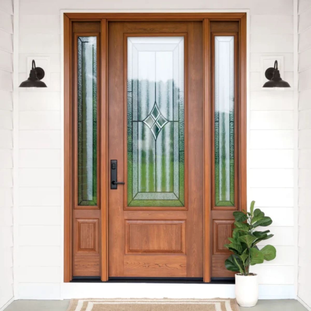 Beautiful wooden front door with large patterned glass panel and two side panels with matching windows