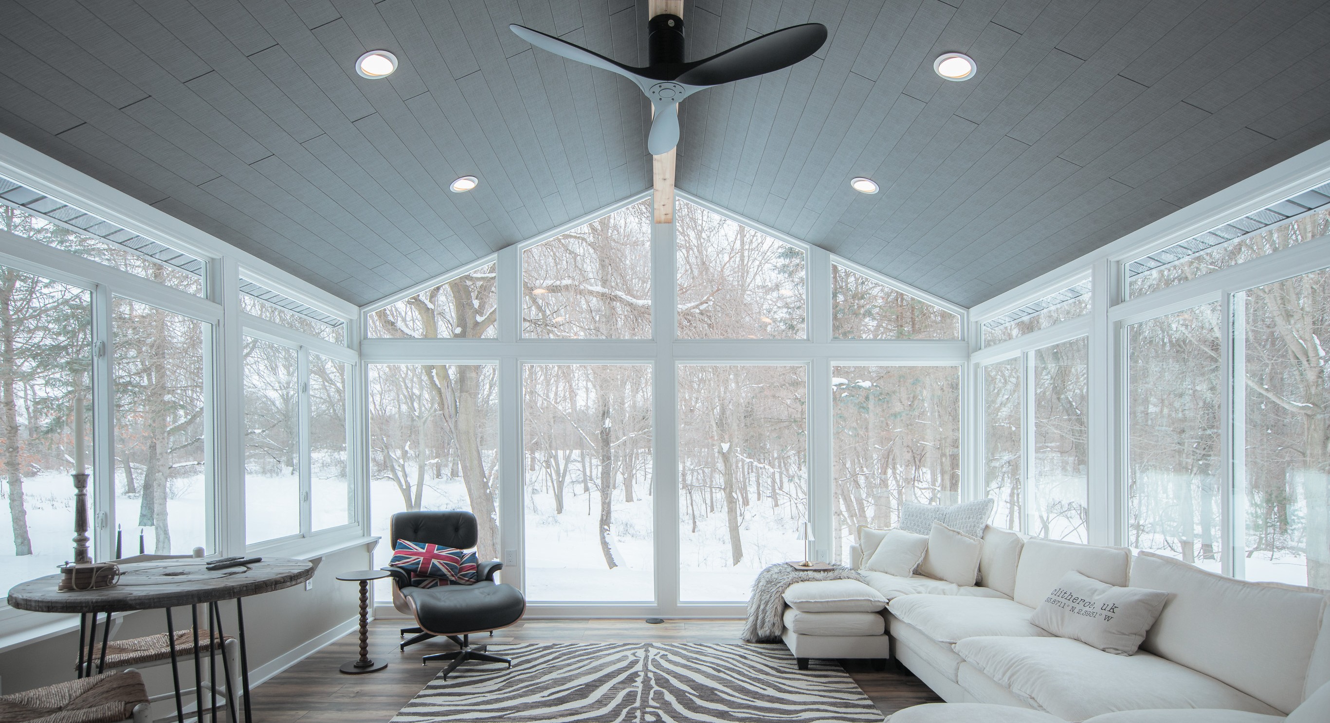 Beautiful sunroom with large windows surrounded by snow in St. Louis MO