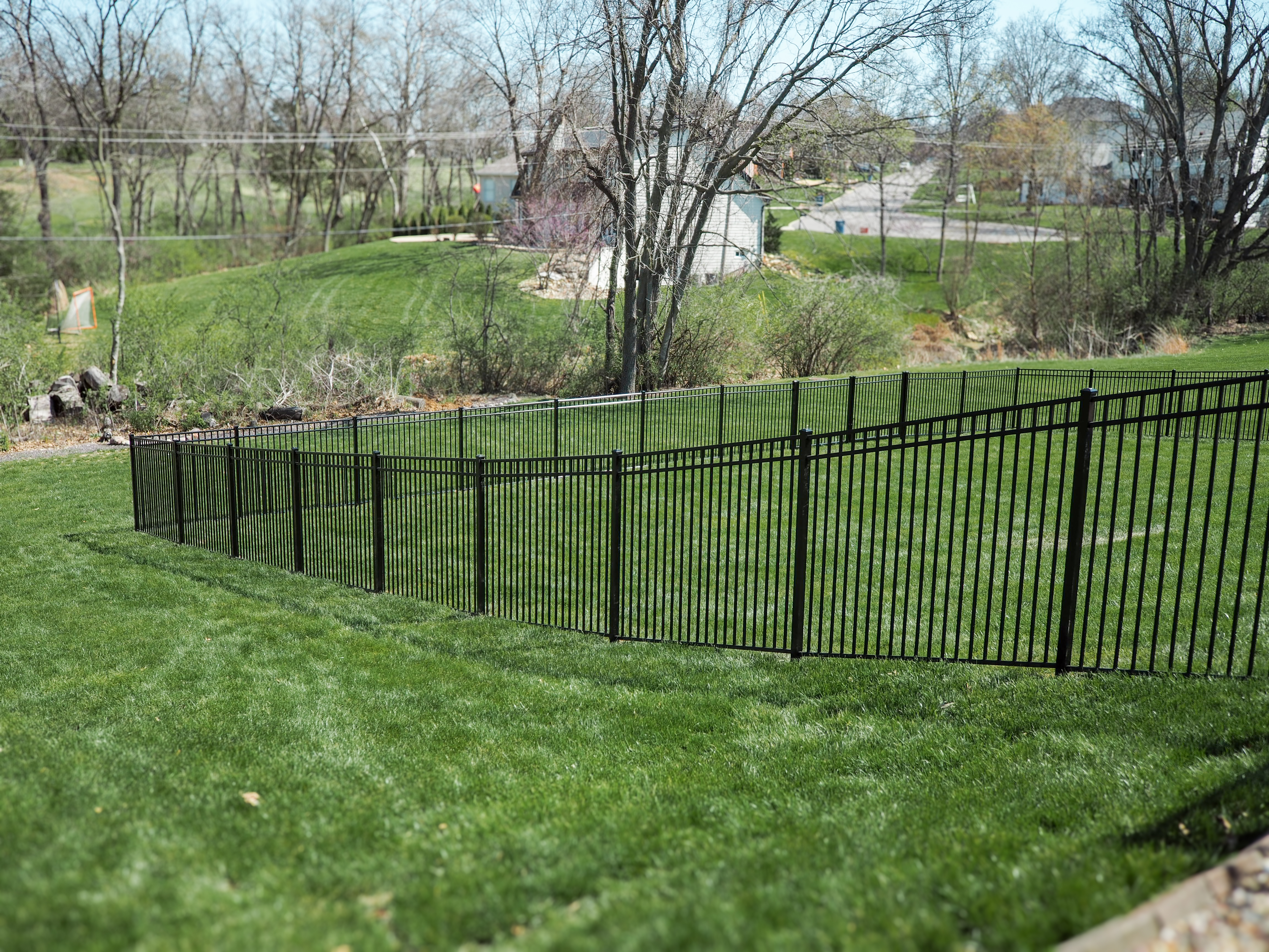 Prestige Aluminum fence in a beautiful spring backyard