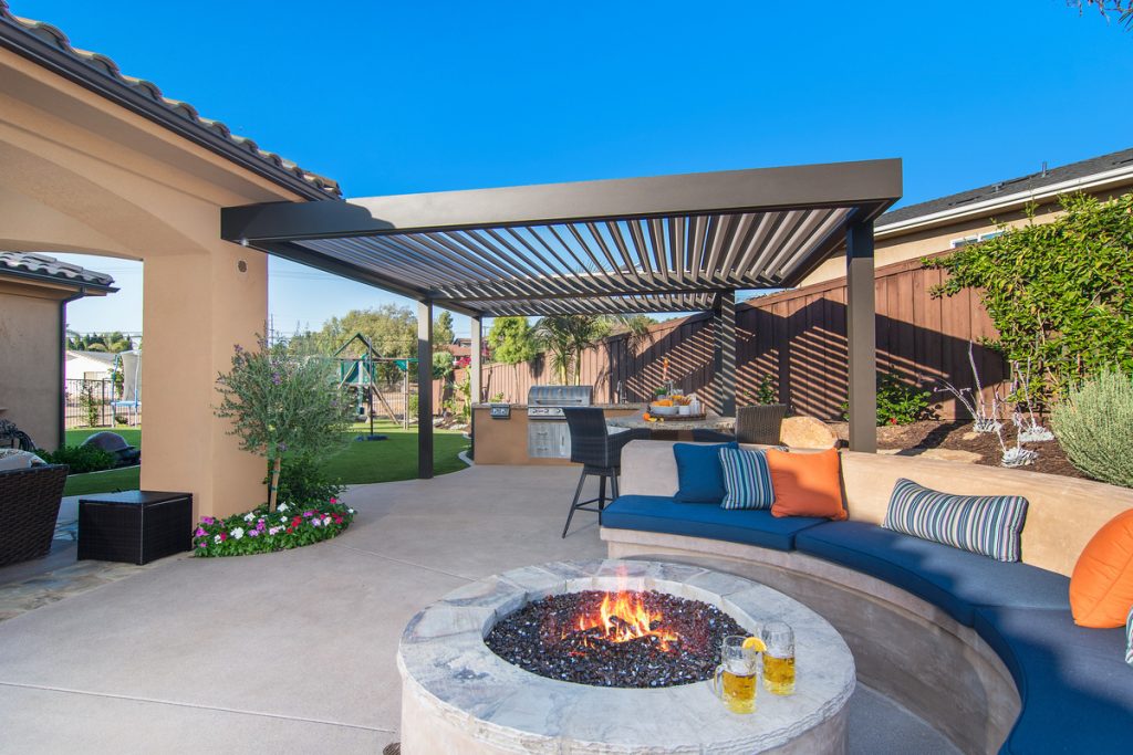 Louvered roof above entertainment outdoor living space