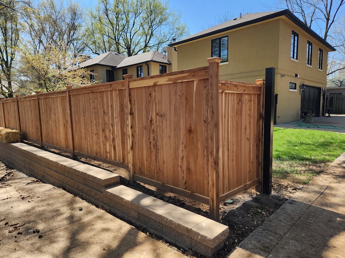 Retaining wall with fence on it
