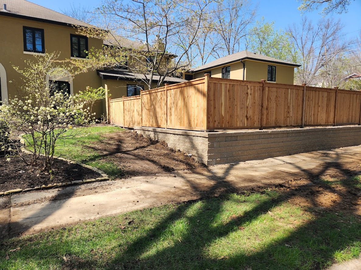 Retaining wall with fence on it