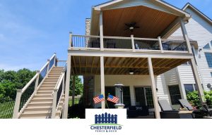 Large khaki deck with a roof sitting area and an under deck.