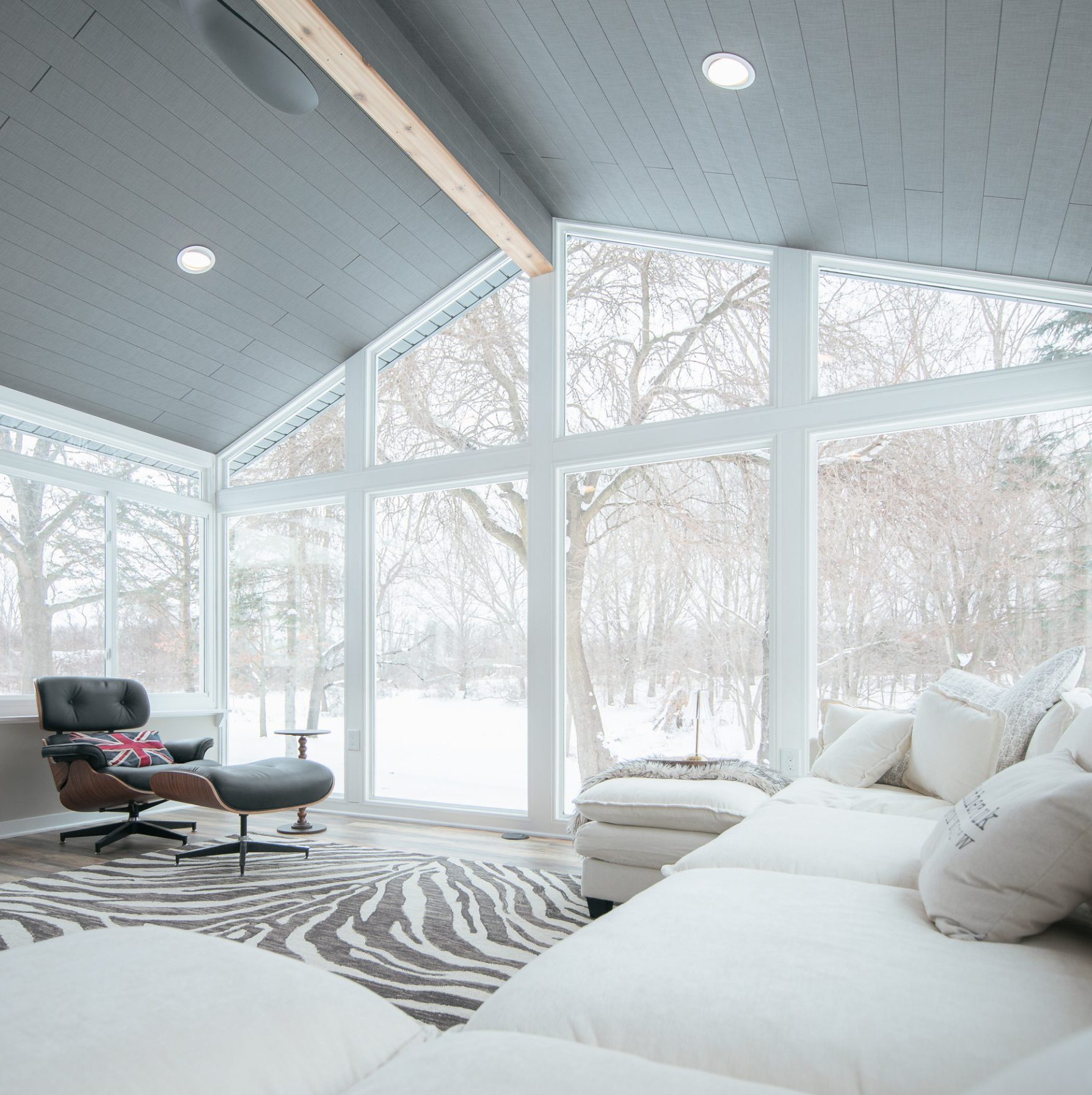 Custom four-season LivingSpace sunroom installation with large windows in a St. Louis MO neighborhood