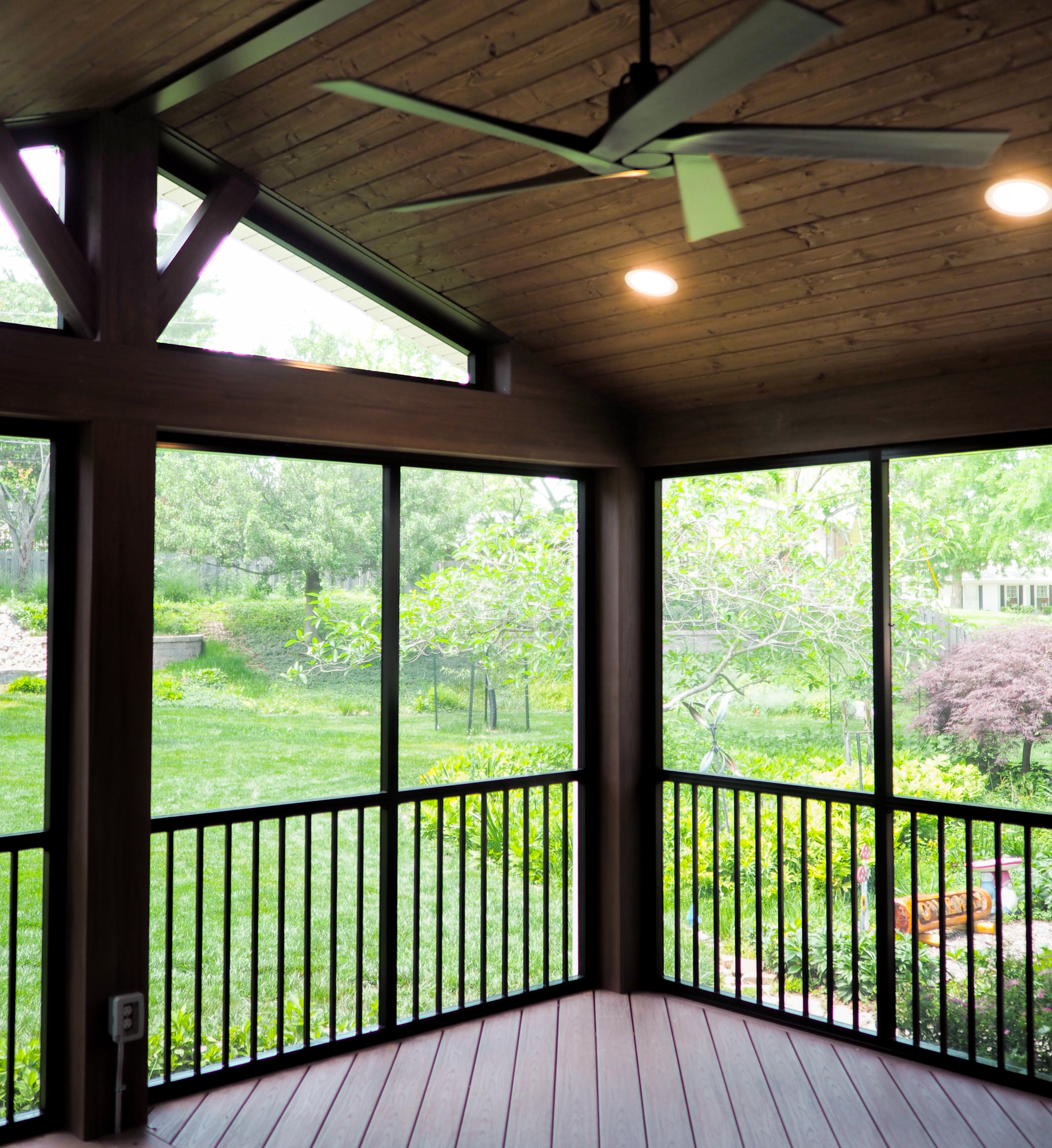Inside of a screen room with a ceiling fan and lights in St. Louis Missouri