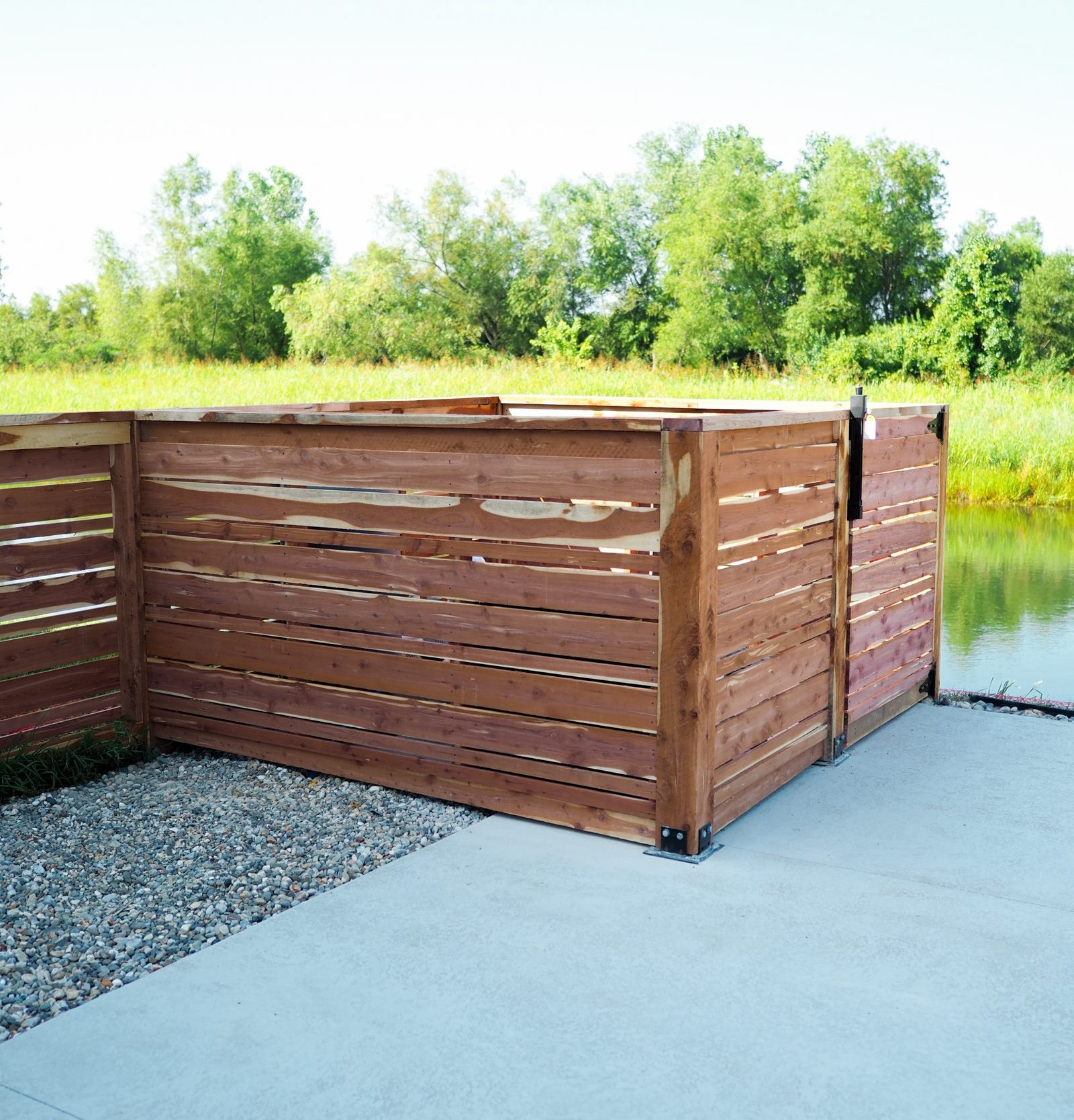 Wood Privacy Fence surrounding pool equipment