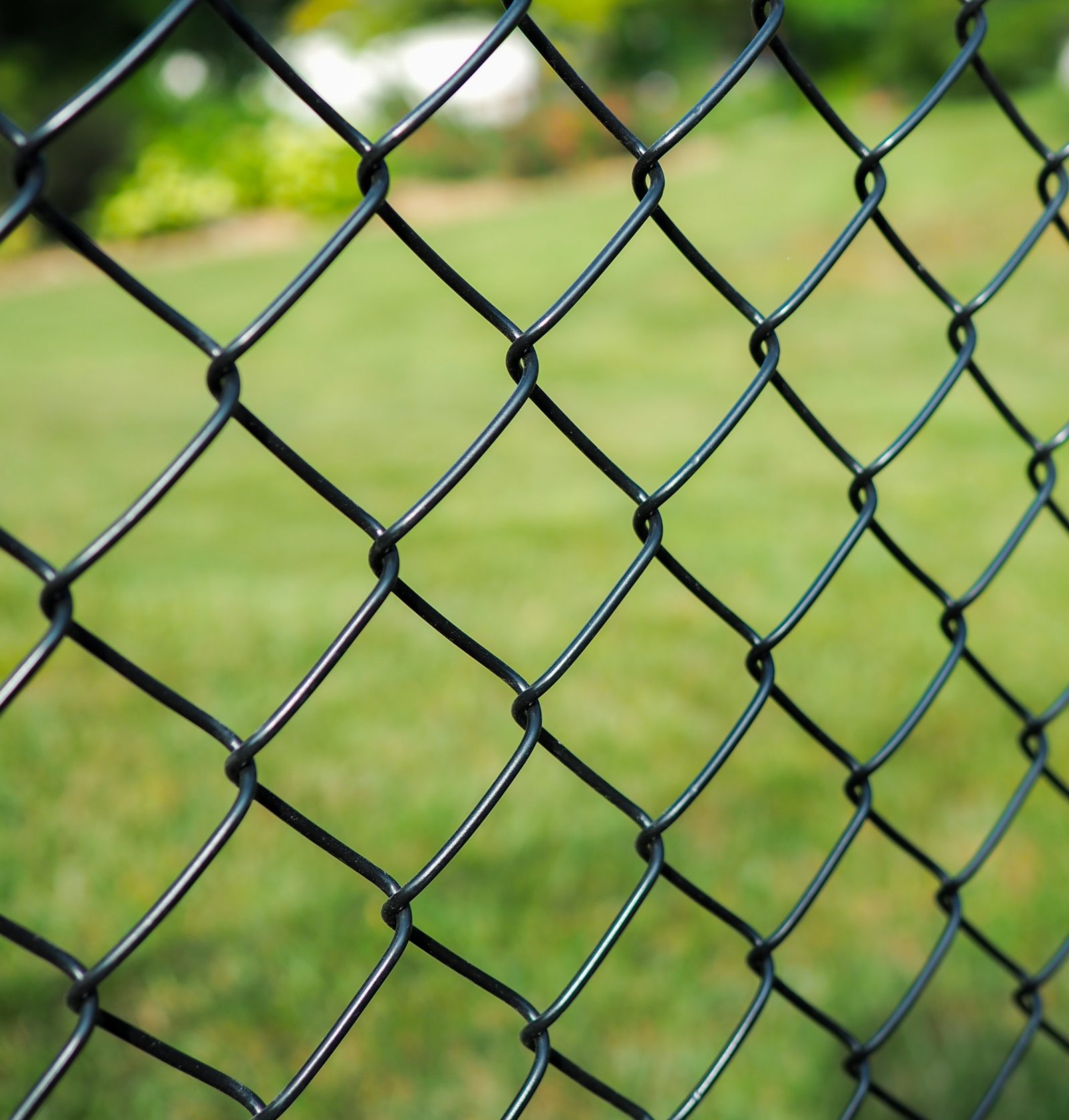 Close up of a black chain link fence