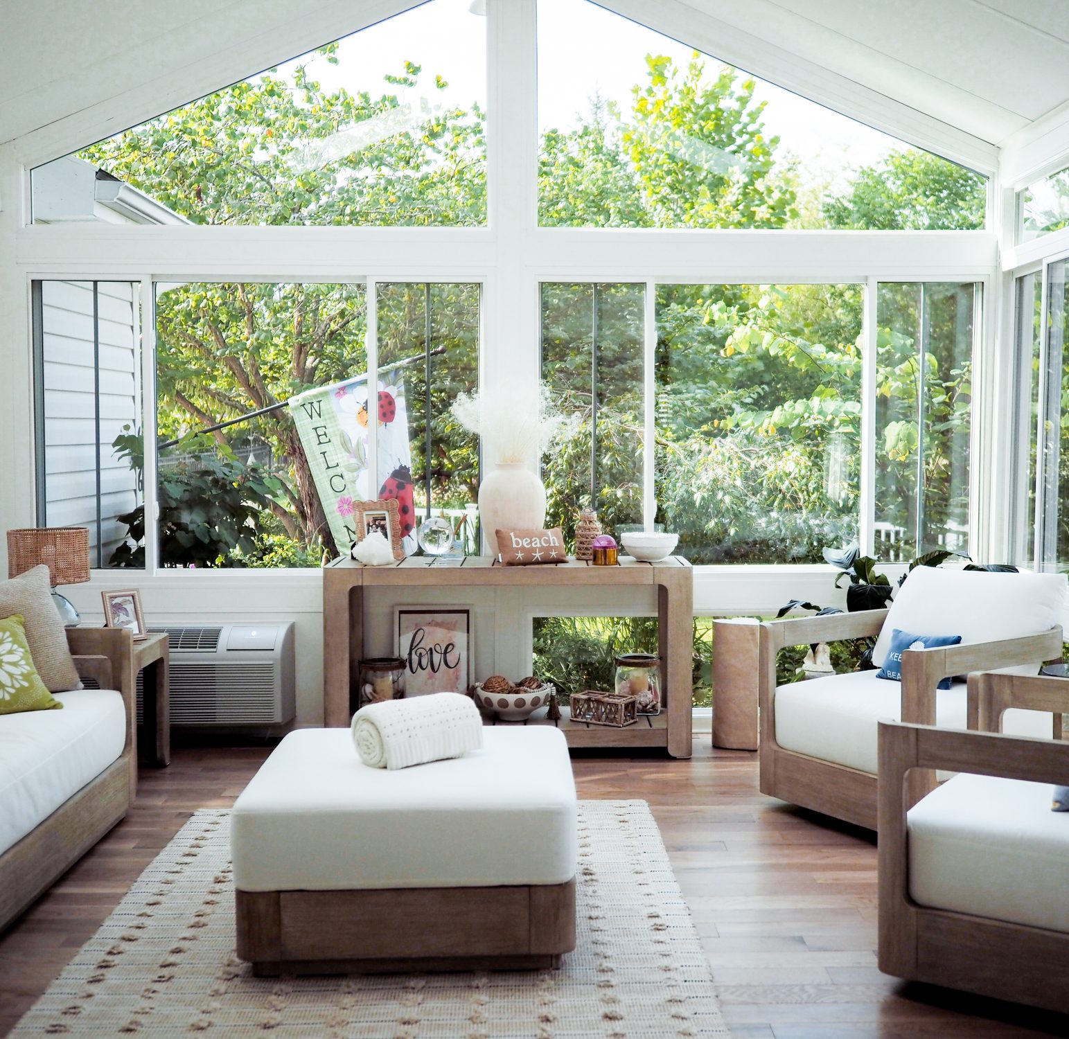 Custom four-season LivingSpace sunroom installation with large windows in a St. Louis MO neighborhood